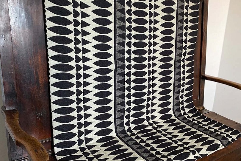 maes caradog black and white on a wooden bench