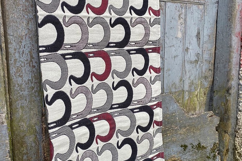 Bugail y mynydd red, black, and grey