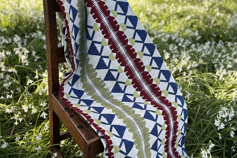 Gweilla a Cribau blanket on a wooden chair